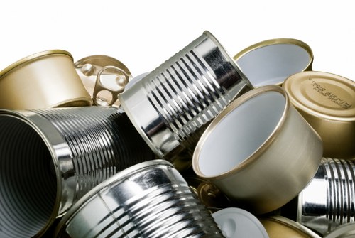 Workers sorting items into recycling, reuse and waste streams during a flat clearance job